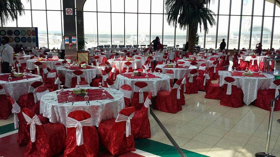 Abu Dhabi — Furniture rental: Banquet Hall Red White Chair Covers