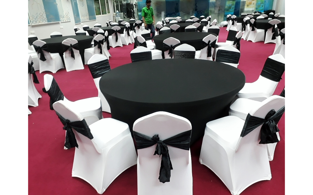 Abu Dhabi — Furniture rental: Banquet Round Tables Black White Sashes