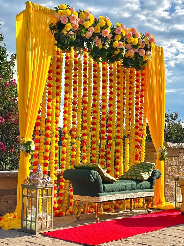 Sharjah — Decorations services: Haldi Marigold Backdrop Green Chaise