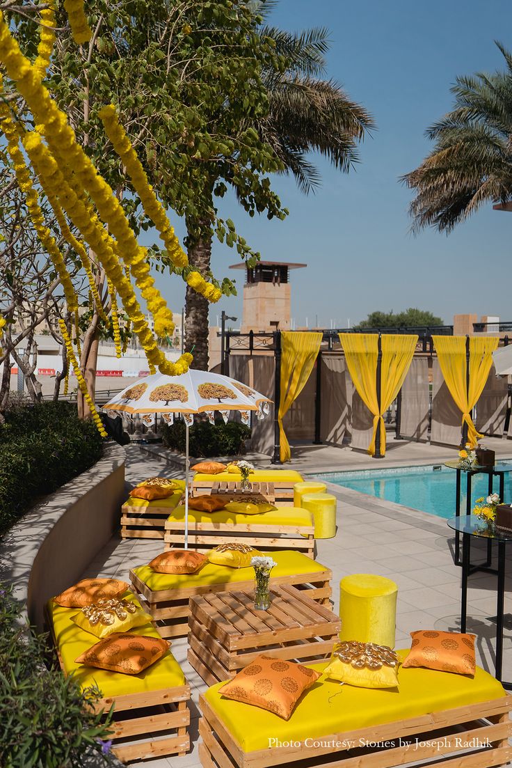 Abu Dhabi — Decorations services: Haldi Poolside Yellow Lounge Setup